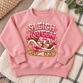 Sleigh Queen sweatshirt flat lay