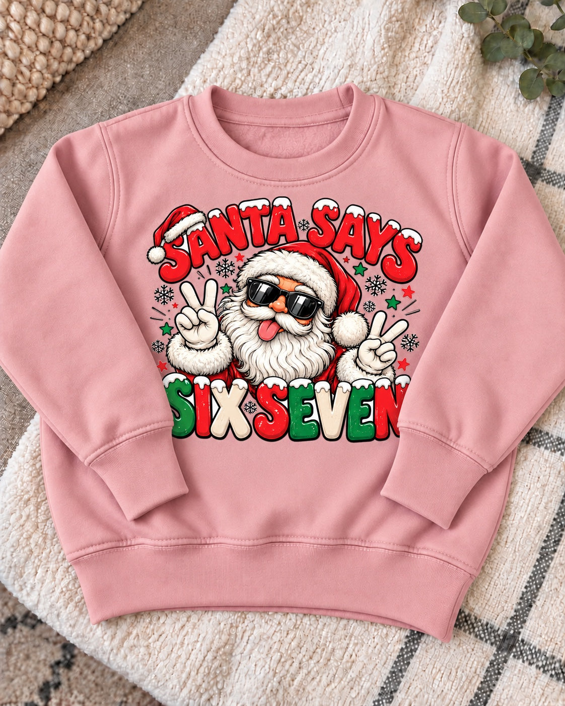 Santa Says Six Seven jumper - dusty pink flat lay